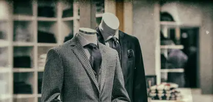 Two men's suit displayed in a shop