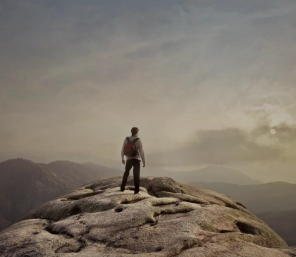 A person on the top of a mountain