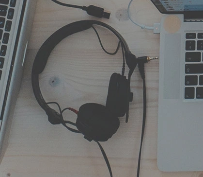 Headphones and two laptops