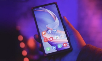 a hand with a mobile phone