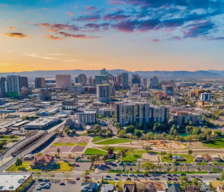 Aerial view of a city skyline at sunset