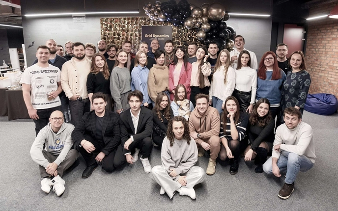 Group photo of the Grid Dynamics team at a company event.