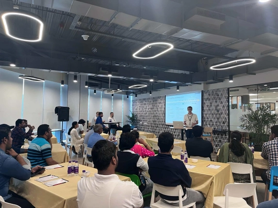Presenter speaking to an audience during a workshop