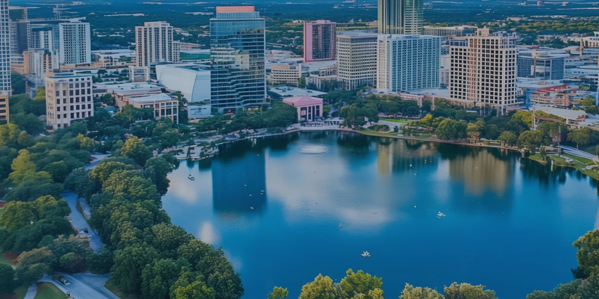 Orlando cityscape with a lake and surrounding buildings.